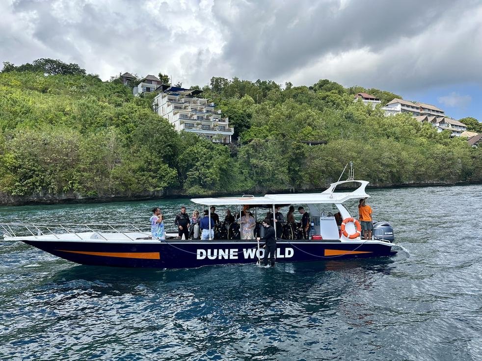 The Dune Penida dive boat in front of the Adiwana Warnakali resort, about 500 m along the shore from Toyapakeh.