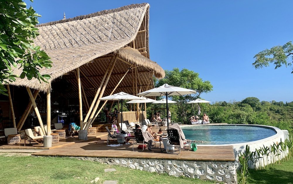 The bamboo Bale Bale and Alang-Alang roof of Amok Sun & Cliff Club, with the infinity pool, Nusa Penida