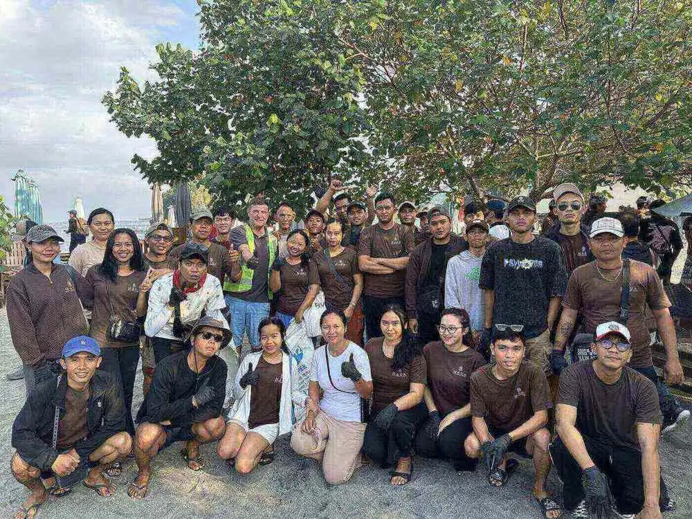 Group of beach clean-up volunteers from Sakti village hotels and businesses at Crystal Bay Nusa Penida