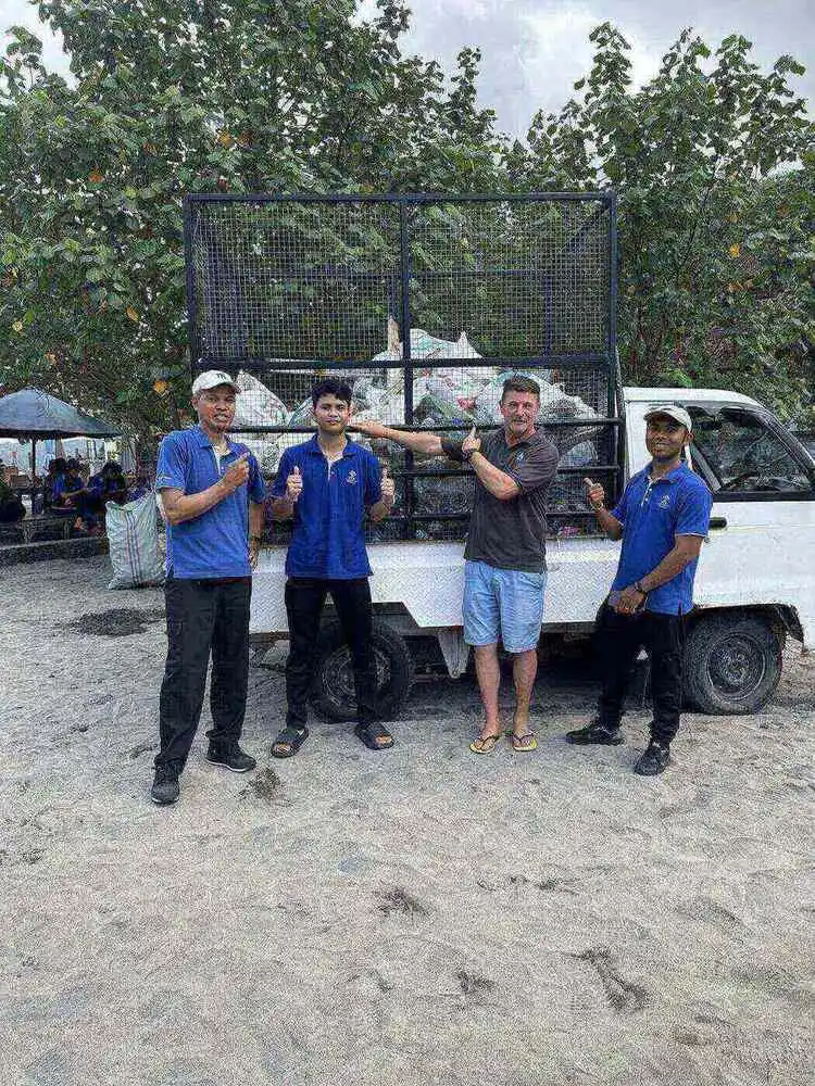 Pick-up truck loaded with bags of waste collected during a Crystal Bay beach clean-up in Nusa Penida