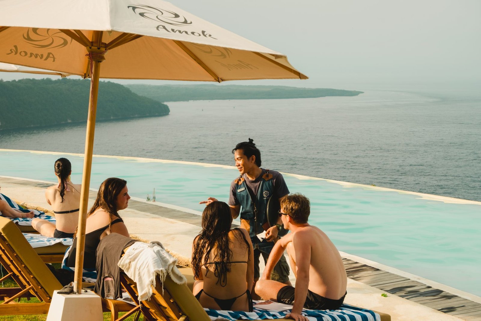 Guests enjoying lunch and the pool at Amok Sun & Cliff Club, Nusa Penida β included in the day-trip from Lembongan