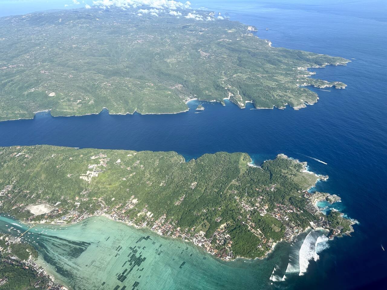 Aerial view of Nusa Ceningan with Nusa Penida in the background across a turquoise channel