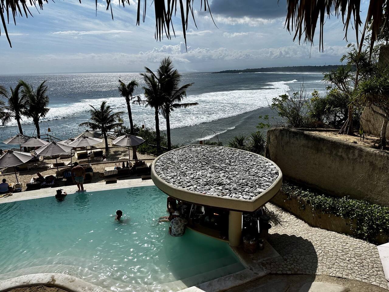 Cliffside beach club overlooking turquoise water on Nusa Ceningan