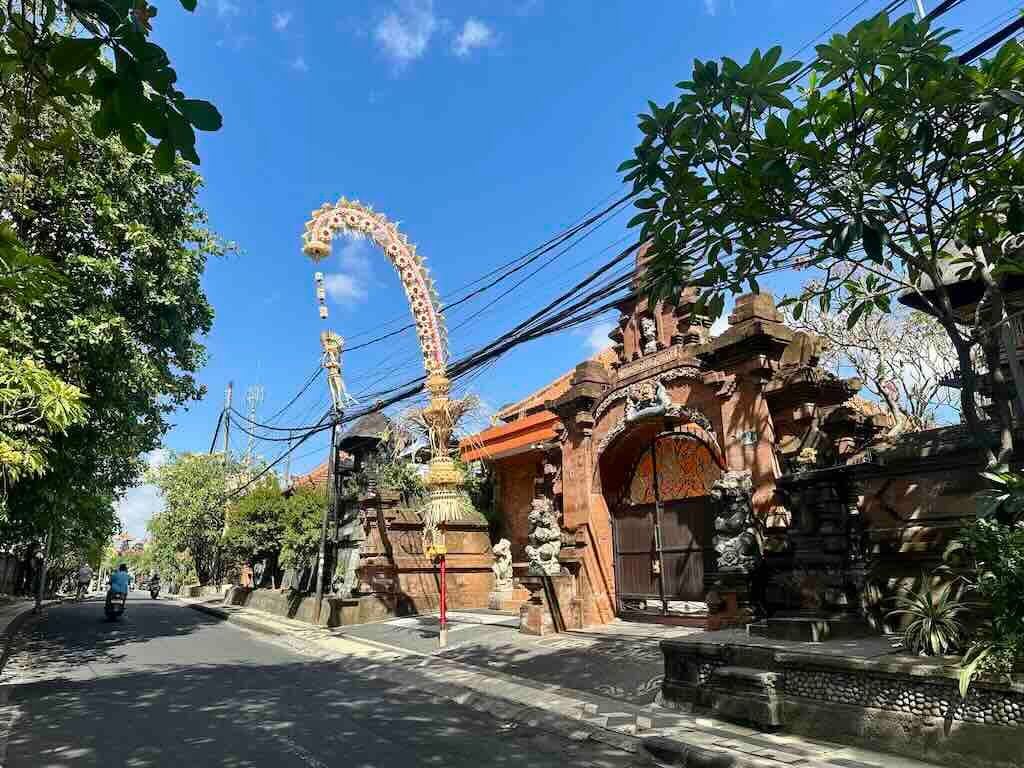Traditional penjor lining a street during Galungan in Bali