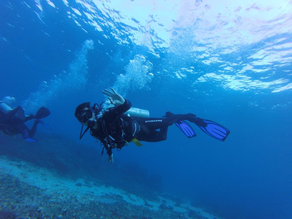 Advanced Open Water diver giving the OK sign on an adventure dive in Nusa Penida