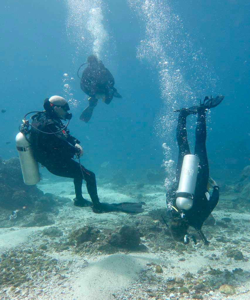 Divers practising trim on the Peak Performance Buoyancy dive, Nusa Penida