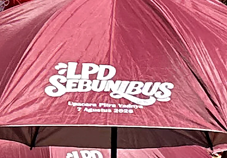 LPD Sebunibus parasol inscribed Upacara Pitra Yadnya – 7 Agustus 2026